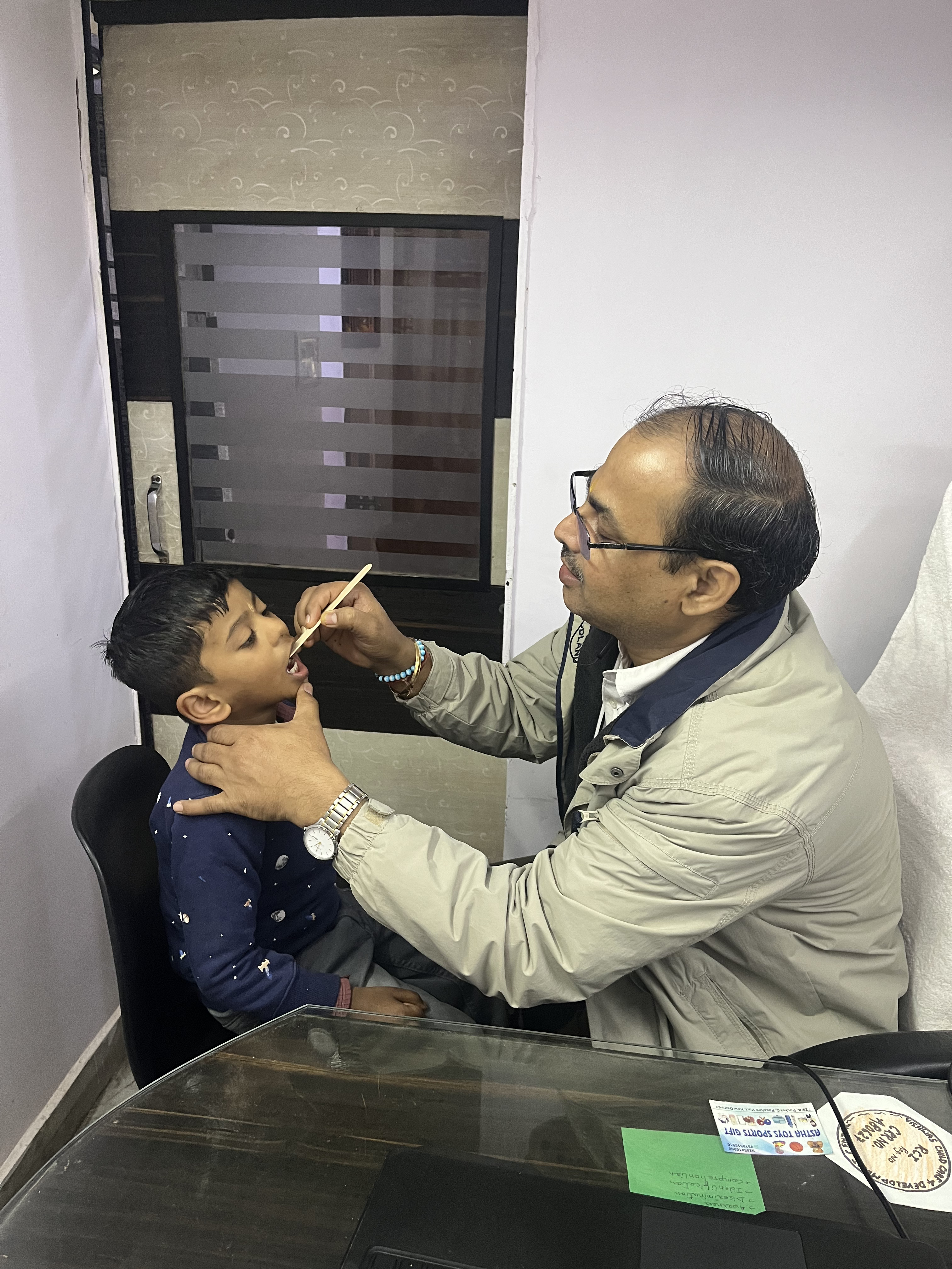 A therapist practising speech sounds with a child